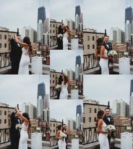 bride and groom dancing on the roof top with the Chicago skyline beings them