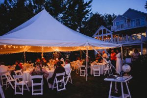 summer backyard wedding reception under a tent