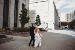 bride and groom walking in detroit