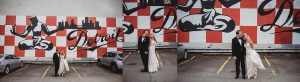 bride and groom laughing and smiling by detroit mural