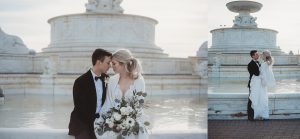 bride and groom hugging by belle isle fountain in winter
