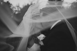 bride and groom kissing under bridal veil wedding pictures Detroit