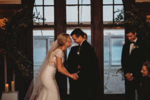 happy laughing wedding couple writes their own wedding vows
