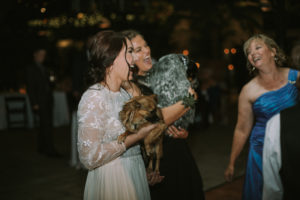 dancing bride with her puppy at Planterra wedding reception
