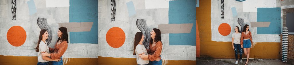 Two girls laughing and hugging 