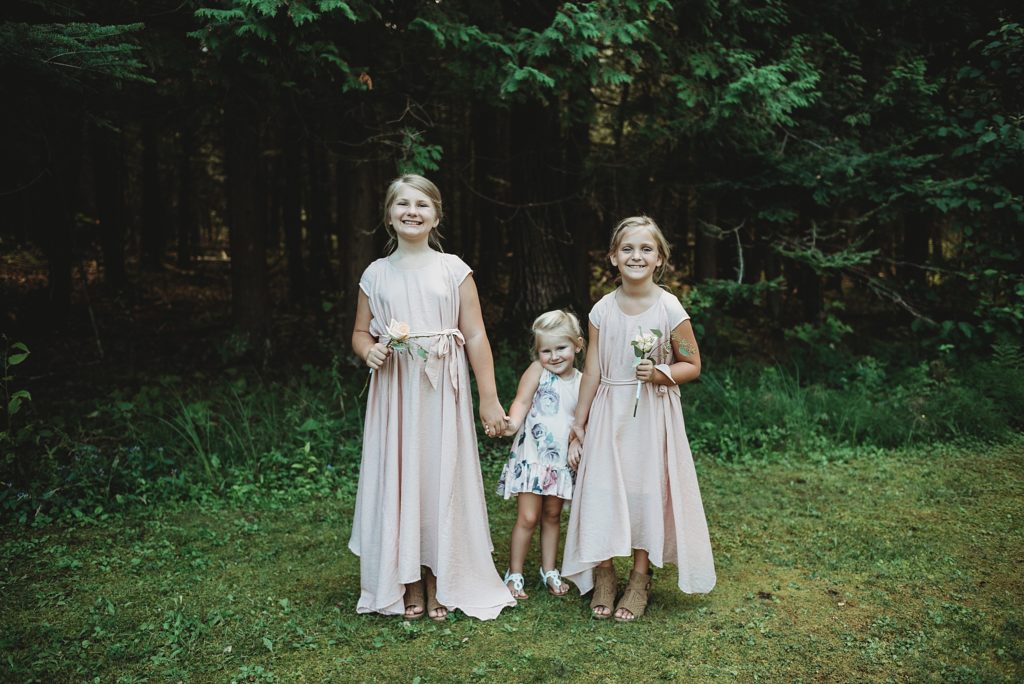 flower girls in light pink and floral dresses