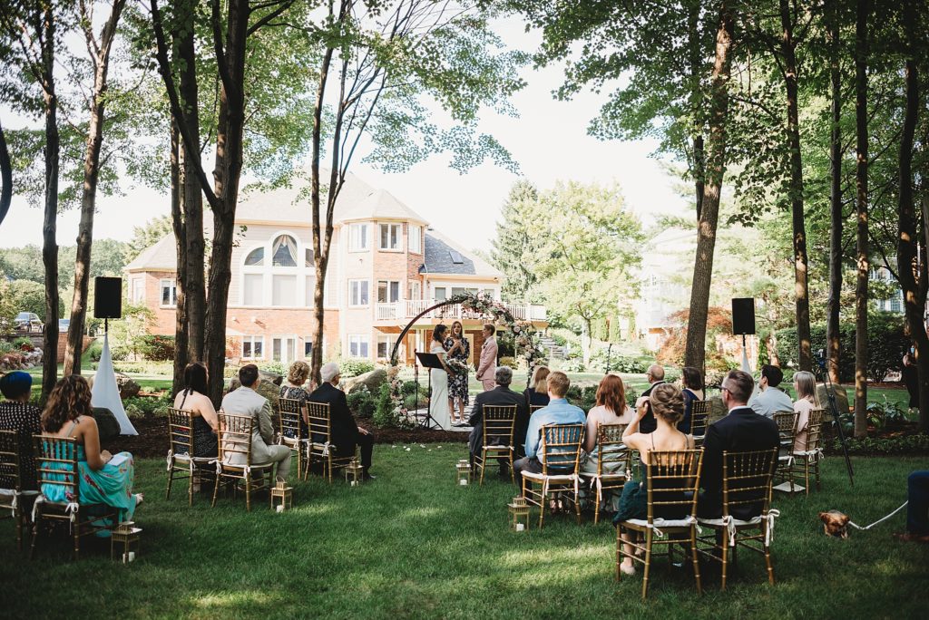 two brides getting married in a backyard elopement wedding ceremony