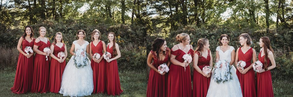 bride and bridesmaid in maroon dresses laughing and smiling