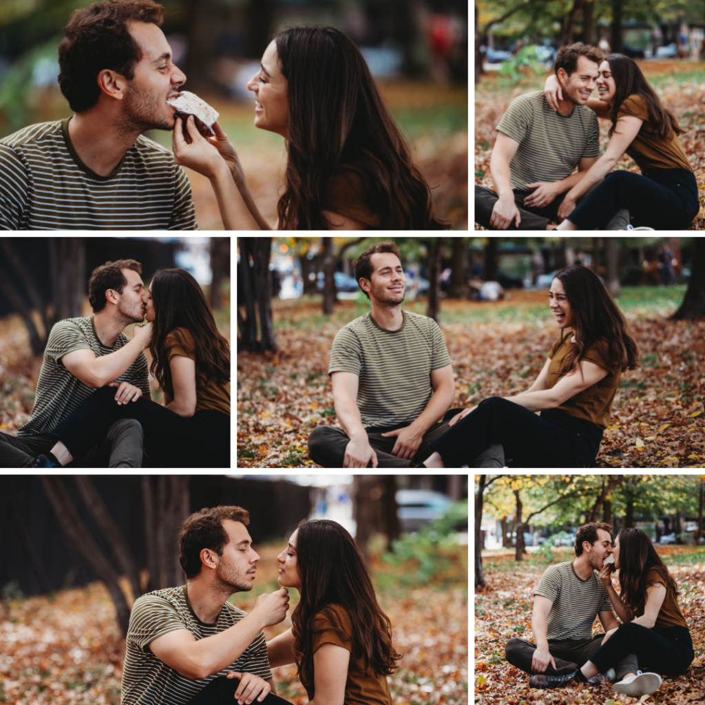 Engagement photos of a couple feeding each other cheesecake in a park in Brooklyn New York on a warm fall afternoon. Laughing and having good time with fall leaves all around them and falling on them 